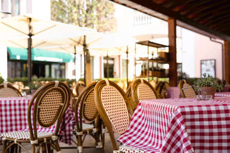Background of outdoor cafe or restaurant. Outdoor cafe with tables, chairs on day time.の写真素材