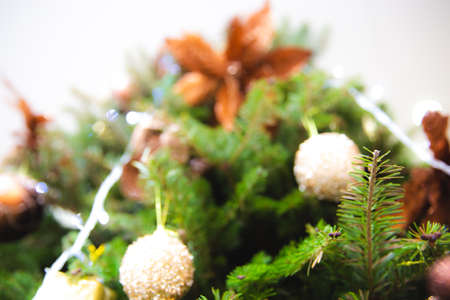 Defocused of bauble hanging on the Christmas tree with little pine. Can be used for background.