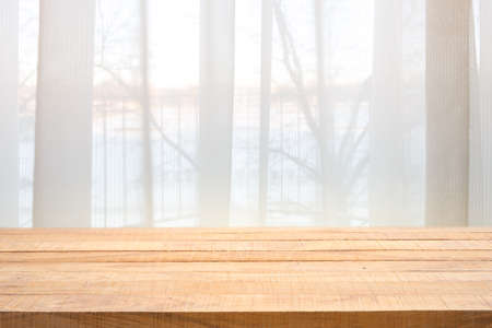 Table top with Defocused curtain window and stationery box with sunlight. For montage product display or design key visual layout.の写真素材