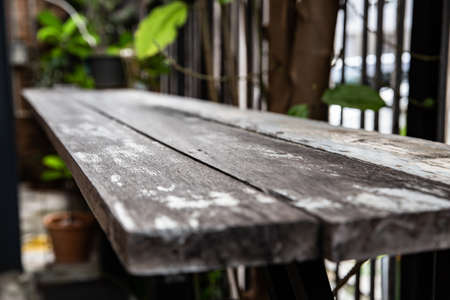 Empty of wood table top with green nature abstract from garden or forest with sunlight. Can be used...
