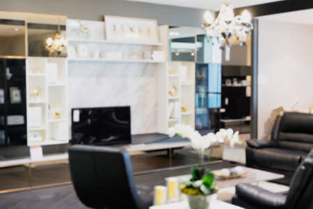 Blurred abstract of modern living room with marble shelf and TV. Decorated with beautiful design of...