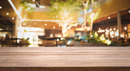 Wood table top Bar with blur of night pub or restaurant with  light bokeh in dark night. Blurred background for product display or montage your products with several concept idea and any occasion. - Imageの写真素材