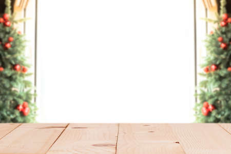Empty wood table top with xmas tree of winter season background.For christmas day and new year concept.の写真素材