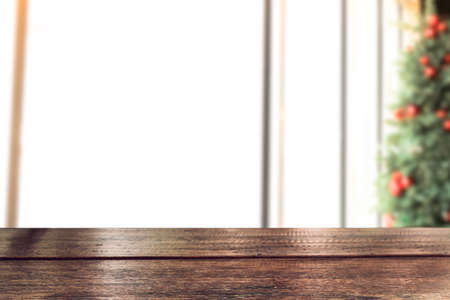 Empty vintage wood table top with xmas tree of winter season background. For christmas day and new year concept.の写真素材