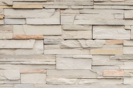 Irregular brick wall with various tint and forms of brickの写真素材