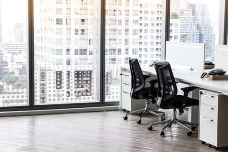 Modern office with open space to work thought the window and background city.の写真素材