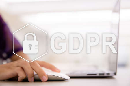 GDPR. Data Protection Regulation. Cyber security and privacy concept. Close up of young female hands...