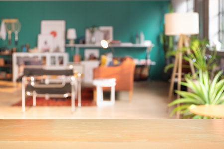 Craft wooden board empty table in front of blurred background. Perspective light wood over blur in living room interior- can be used for display or montage your products. Mock up for display of productの写真素材