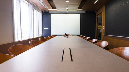 Empty business conference room interior. Modern table boardroom with chair in morning.の写真素材