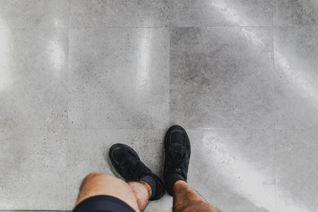 Modern Sportswear Design: A Pair of Stylish Black Sneakers, Signifying 'Time to Work Out!' Specifically Crafted for High-Performance Gym Activities, Yet Perfectly Suited as All-Purpose Footwear for a Wide Range of Casual and Active Uses.の写真素材