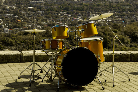 golden yellow drum set on the mountain viewing deck, concert preparationの写真素材