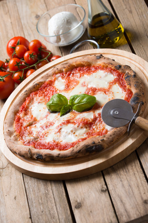 Wood oven baked italian pizza margheritaの写真素材