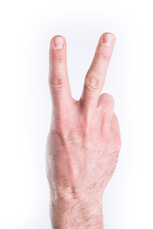 Man's hand mimic numbers on white backgroundの写真素材