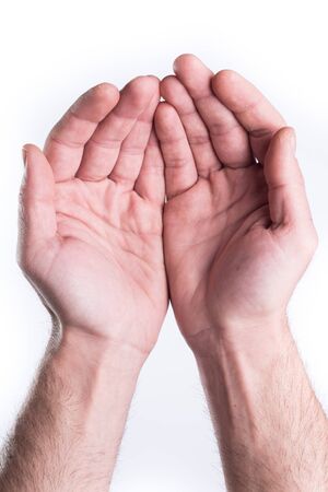 Man's hand plead charity on white backgroundの写真素材
