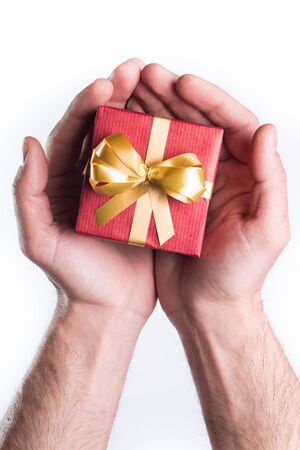 Concept hands giving gift on white backgroundの写真素材
