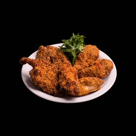 Fried chicken thigh on black background still lifeの写真素材