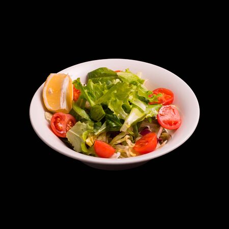 Fresh salad on black background still lifeの写真素材