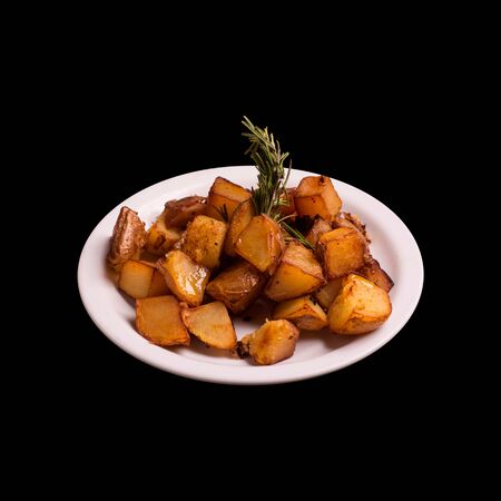 Backed potatoes on black background still lifeの写真素材