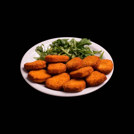 Fried chicken nugs on black background still lifeの写真素材