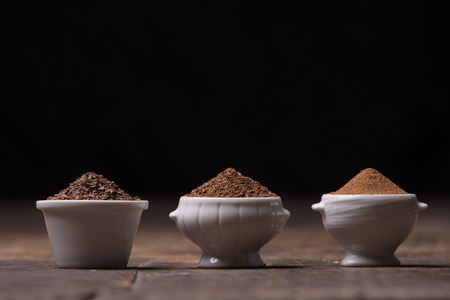 Different type of carobs flour on stille life compositionの写真素材