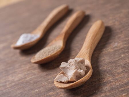 dry yeast, fresh yeast and instant yeast on top view wood table compositionの写真素材