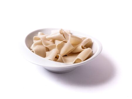 raw unfinished biang biang noodles ready for ingredients topping on white backgroundの写真素材