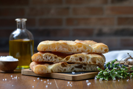 Crmbly Roman style focaccia, Florentine flatbread, Roman-style pizza in palaの写真素材