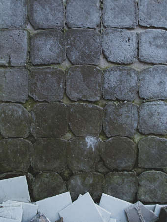 Grungy grey old tile wall background texture. Abandoned, depressive, post-apocalypse atmosphere.