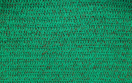 Hanf made handicraft green knitted yarn background texture.の写真素材