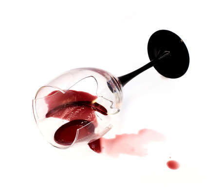 Dry sweet white wine in a broken glass isolated on white background. For winery, bar or restaurant tasting event or party ads, cards or posters.の写真素材