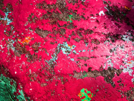 Old painted granite stone rock background. In red and grey colors.