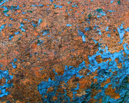 Old painted granite stone rock background. Blue, yellow, brown, orange colorsの写真素材