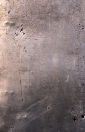 Old scratched grungy silver grey metal tin background.