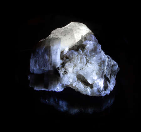 Shiny luminous transparent quartzite mineral crystal from Alchak, Crimea. A backlight photo of a...