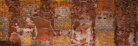 Old aged yellow orange red brick wall texture background.