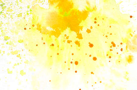 Yellow and orange splashes, hand painted watercolor background.の写真素材