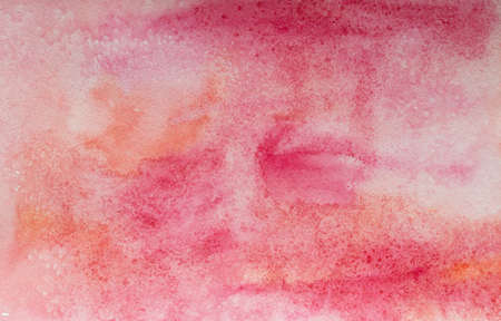 Light red and pink hand painted watercolor background.の写真素材