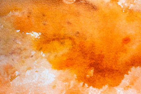Bright orange hand painted watercolor background texture.の写真素材