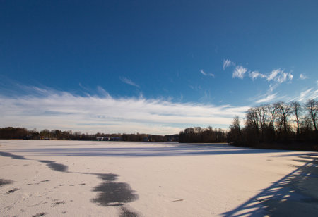 Trakai lake covered with ice in pleasant sunny cold winter day.の写真素材