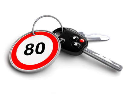 Car keys with speed limit traffic sign as keyring - concept for cars speeding