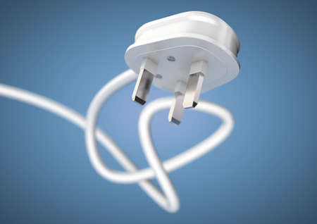 Electrical appliance plug attached to electricity cable. Strong depth of field. White plug and cable coiled isolated. Unplug an electrical appliance plug to save electricity.の写真素材