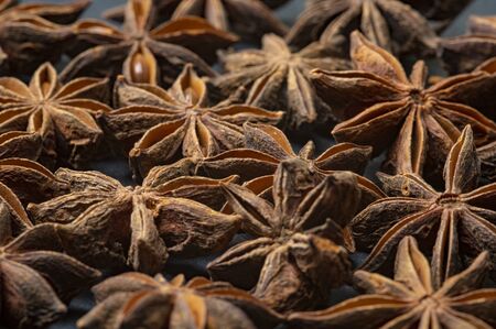 Brown star Anise scattered on the tableの写真素材