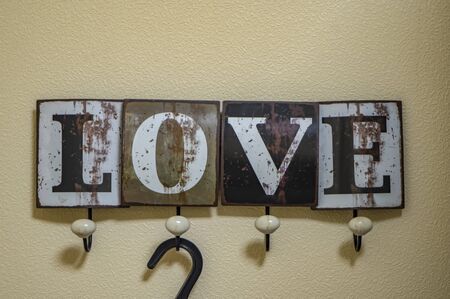 Children's clothing shelf with gray letters baby with baby boomers. Decor of the children's room in gray pastel colorsの写真素材