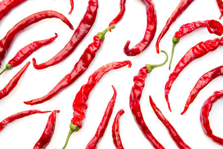 Dried chili peppers isolated on white background top and bottom arrangement. Flat layout.