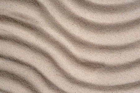 Wavy sand. Summer beach background. View from aboveの写真素材