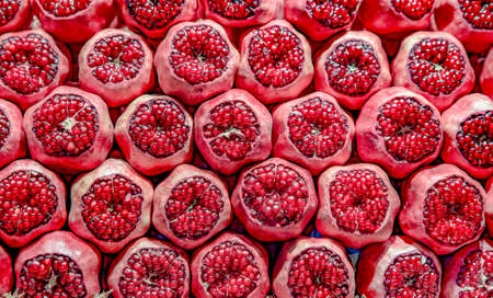 Rows Of Pomegranates. Pomegranate Closeup, Background. Group Of Ripe Pomegranates Fruits Neatly Laid Out On Counter In Store.の写真素材