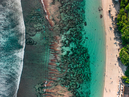 Breathtaking aerial view of the bustling coastline of Melasti Beach, Baliの写真素材