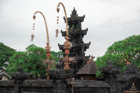 Majestic temple decorated for the festival with traditional offerings under cloudy skyの写真素材