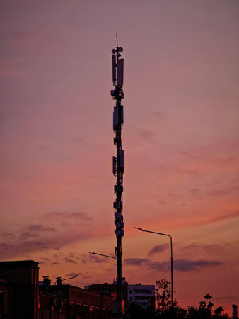 Cell phone mast against the sunsetの写真素材