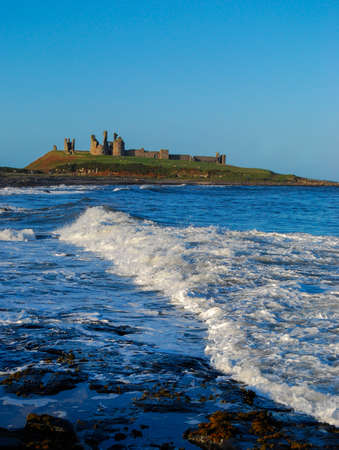 Dunstanburgh Castle from Craster,North East UKの写真素材